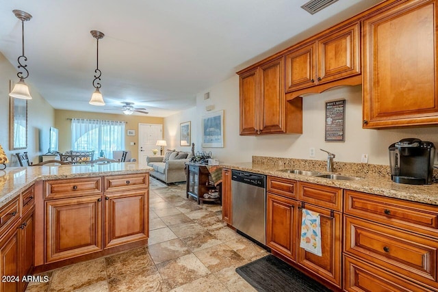 kitchen with dishwasher, sink, ceiling fan, decorative light fixtures, and light stone counters