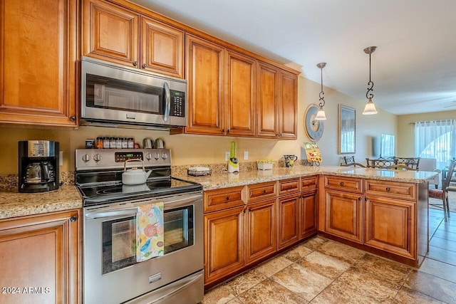 kitchen featuring kitchen peninsula, pendant lighting, stainless steel appliances, and light stone counters