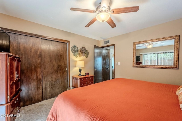 bedroom featuring carpet, ceiling fan, and a closet