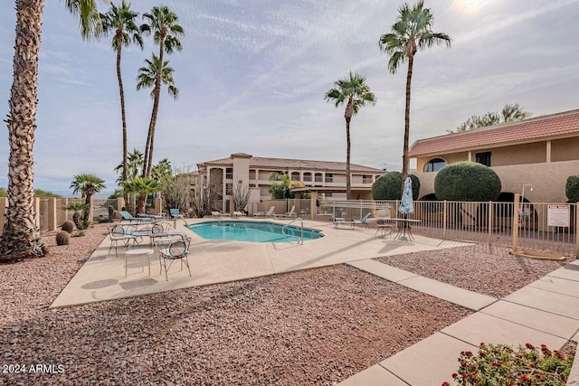 view of swimming pool with a patio