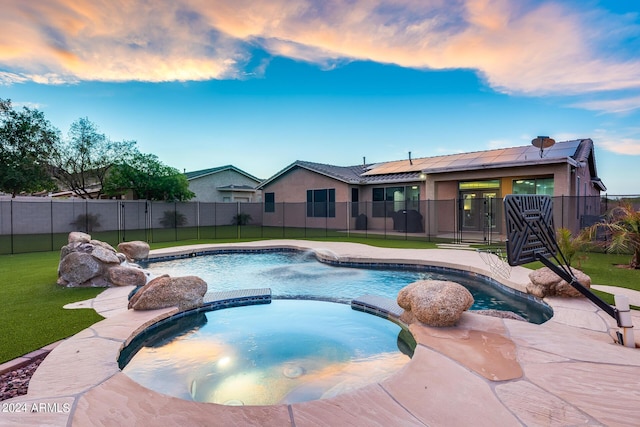 pool at dusk with a yard