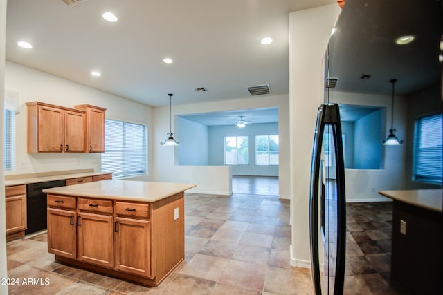 kitchen featuring dishwasher, a center island, ceiling fan, and decorative light fixtures