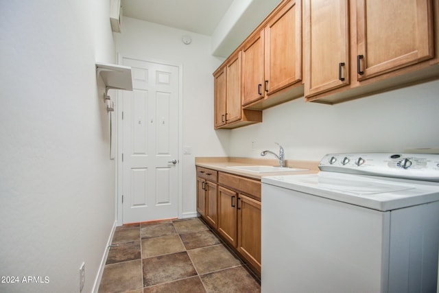 laundry room with cabinets, washer / dryer, and sink