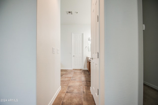 hallway with light tile patterned floors