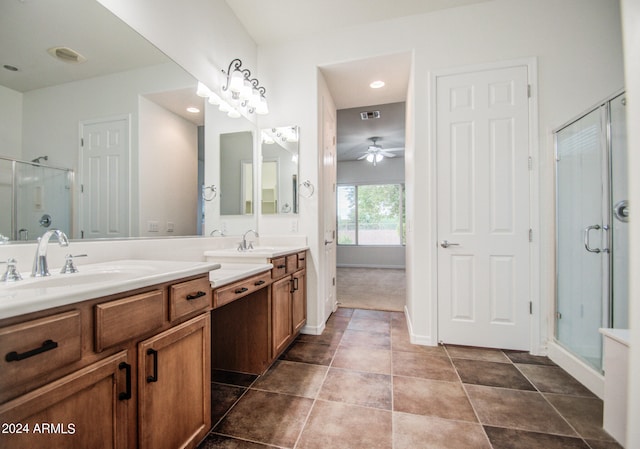 bathroom with ceiling fan, vanity, and a shower with shower door