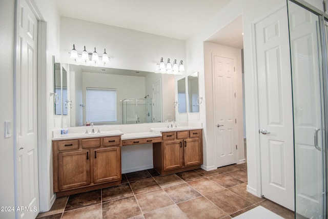 bathroom featuring vanity and a shower with shower door