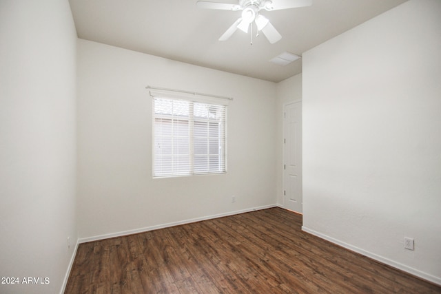 unfurnished room with ceiling fan and dark hardwood / wood-style floors