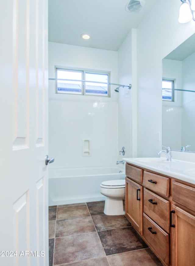 full bathroom featuring vanity, shower / washtub combination, a healthy amount of sunlight, and toilet