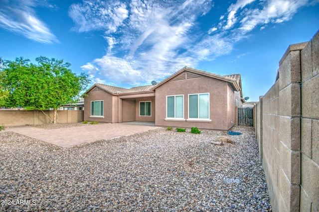 back of property with a patio area