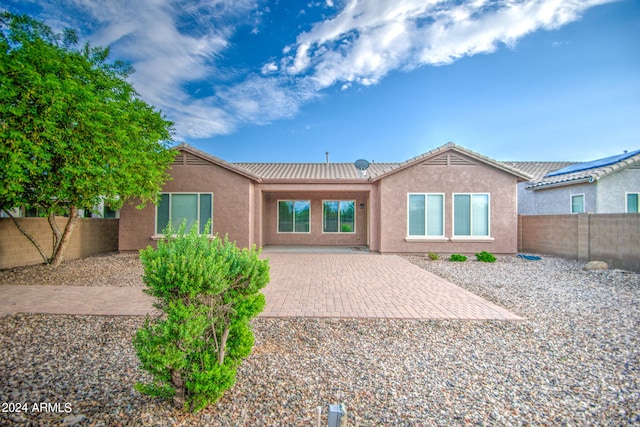 rear view of house with a patio