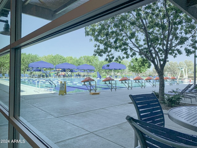 view of patio featuring a community pool