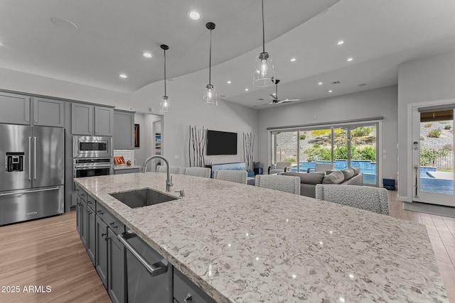 3326 Josey Wales Way, Wickenburg, AZ 85390 - kitchen featuring stainless steel appliances, a sink, recessed lighting, open floor plan, and light wood-style floors