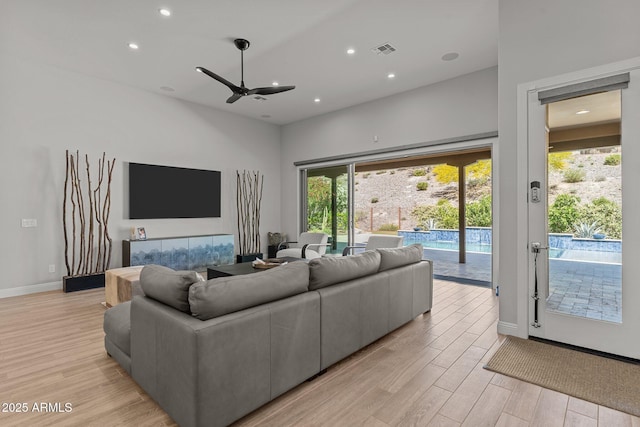 3326 Josey Wales Way, Wickenburg, AZ 85390 - living area featuring light wood-style floors, recessed lighting, ceiling fan, and baseboards