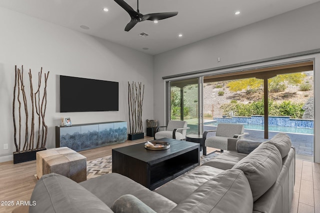 3326 Josey Wales Way, Wickenburg, AZ 85390 - living room featuring a ceiling fan, light wood finished floors, recessed lighting, and a high ceiling