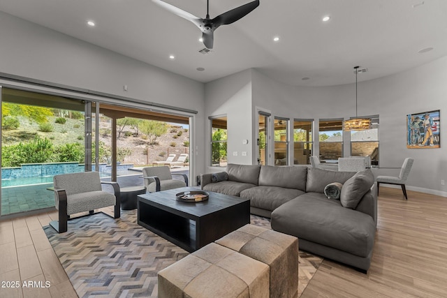 3326 Josey Wales Way, Wickenburg, AZ 85390 - living area featuring recessed lighting, a high ceiling, light wood-style floors, baseboards, and ceiling fan