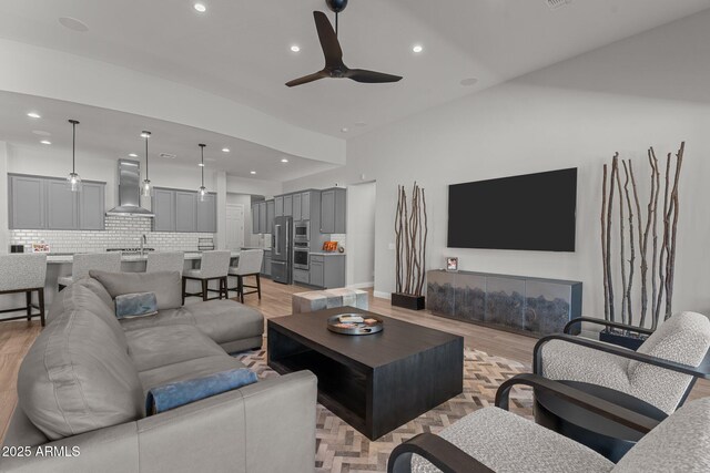 3326 Josey Wales Way, Wickenburg, AZ 85390 - living area featuring light wood-style floors, recessed lighting, a ceiling fan, and baseboards