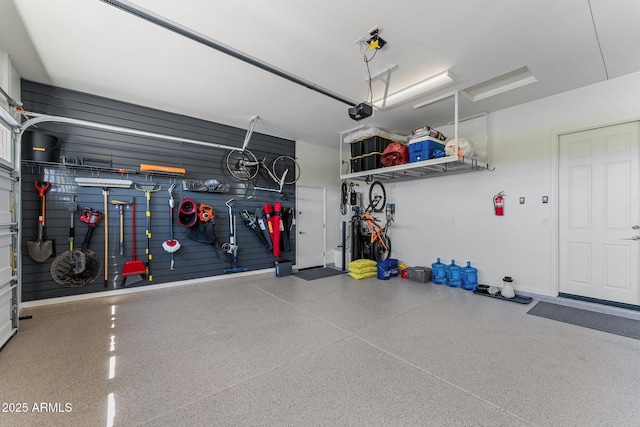 3326 Josey Wales Way, Wickenburg, AZ 85390 - garage featuring a garage door opener and baseboards