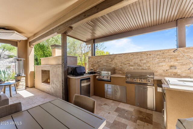 3326 Josey Wales Way, Wickenburg, AZ 85390 - view of patio featuring a grill and an outdoor kitchen