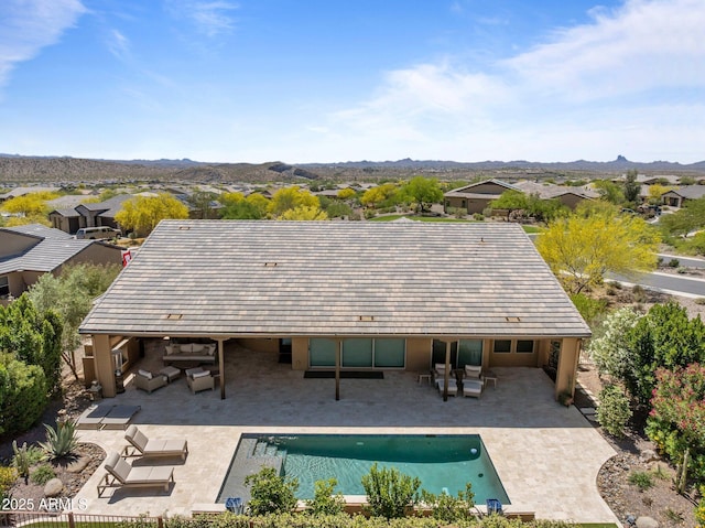 3326 Josey Wales Way, Wickenburg, AZ 85390 - outdoor pool with an outdoor hangout area, a mountain view, and a patio area