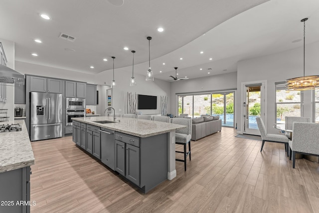 3326 Josey Wales Way, Wickenburg, AZ 85390 - kitchen featuring appliances with stainless steel finishes, a sink, gray cabinets, recessed lighting, and light wood-type flooring
