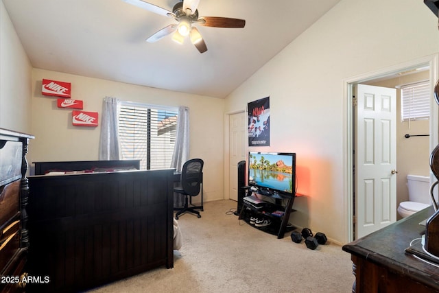 bedroom featuring ceiling fan, light colored carpet, and lofted ceiling