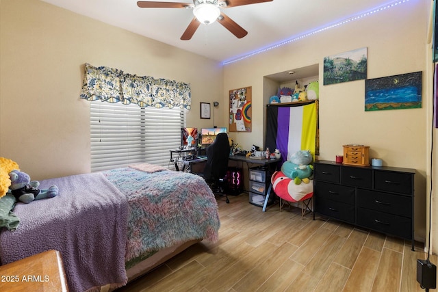 bedroom featuring ceiling fan and light hardwood / wood-style floors