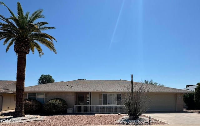 12515 W Rampart Dr, Sun City West, AZ 85375 - single story home with a porch and a garage