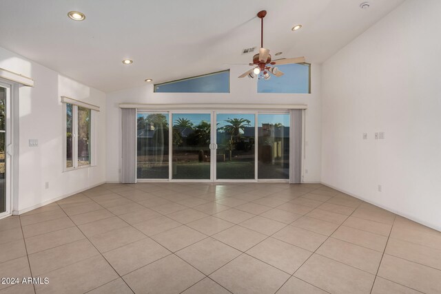 interior space featuring ceiling fan and high vaulted ceiling