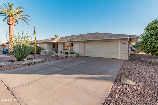 single story home featuring a garage