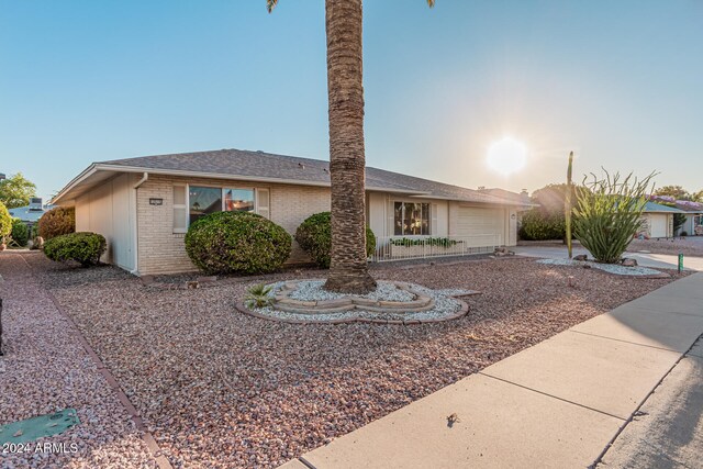 single story home featuring a garage