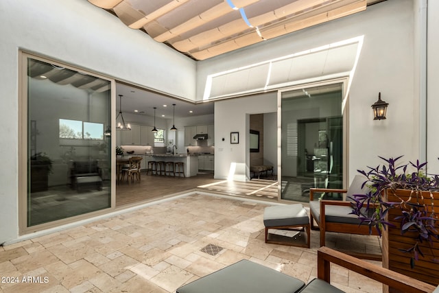 view of patio with an outdoor kitchen and sink