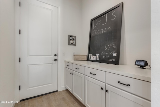 doorway with light hardwood / wood-style flooring