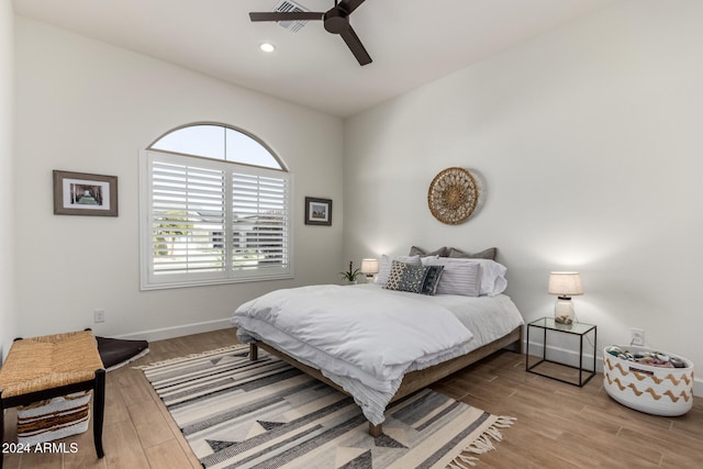 bedroom featuring light hardwood / wood-style floors and ceiling fan