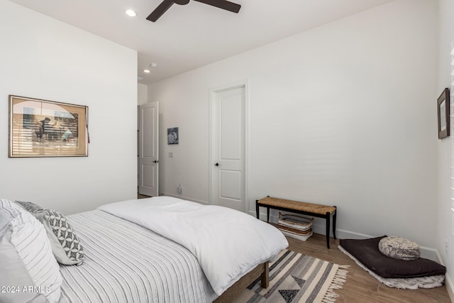 bedroom featuring hardwood / wood-style floors and ceiling fan