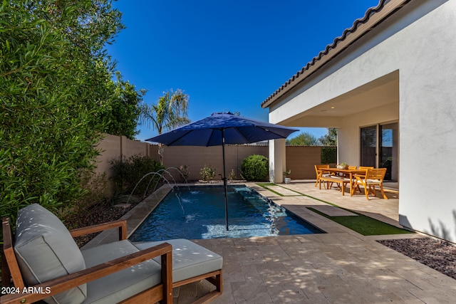 view of pool featuring a patio area and pool water feature