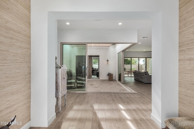 hallway with wood-type flooring