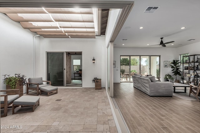 interior space featuring ceiling fan and light hardwood / wood-style flooring