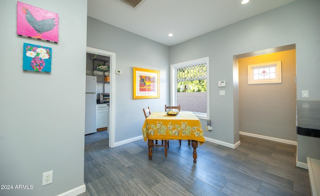 dining room with dark wood-type flooring