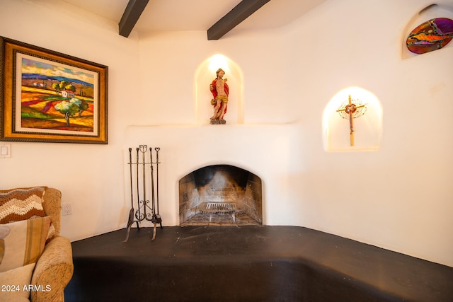 living room with beam ceiling