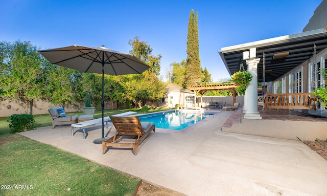 view of swimming pool with a patio area and a pergola