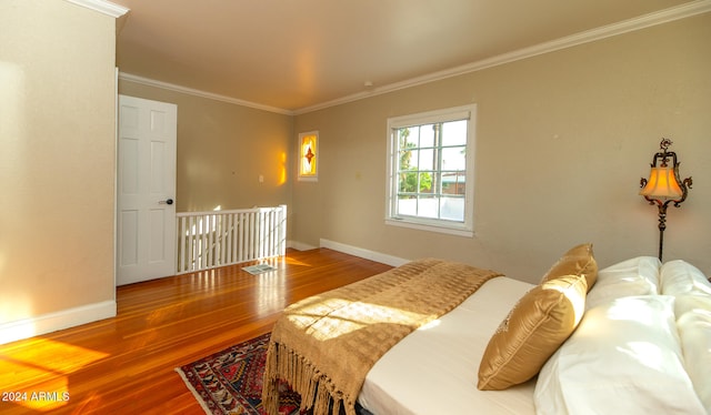 bedroom featuring ornamental molding and wood-type flooring