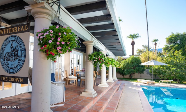 view of swimming pool featuring a patio