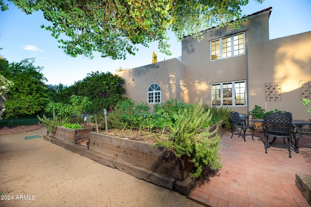 back of house with a patio