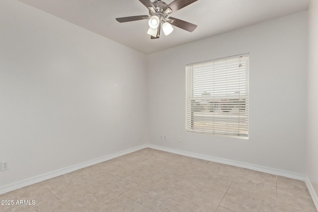 unfurnished room featuring light tile patterned flooring, ceiling fan, and baseboards