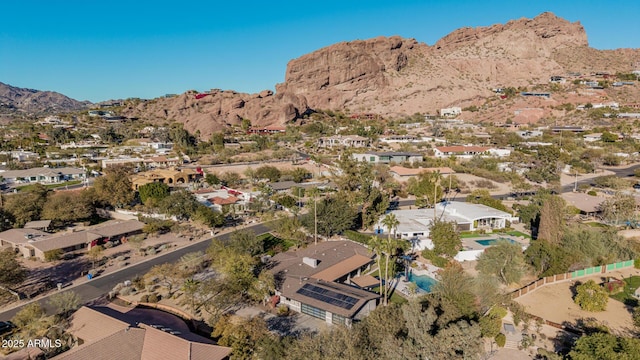 birds eye view of property featuring a mountain view