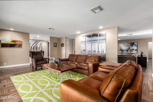 living room featuring dark parquet floors