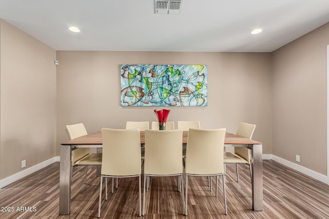 dining space featuring hardwood / wood-style floors