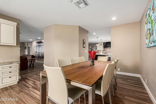 dining area with dark wood-type flooring