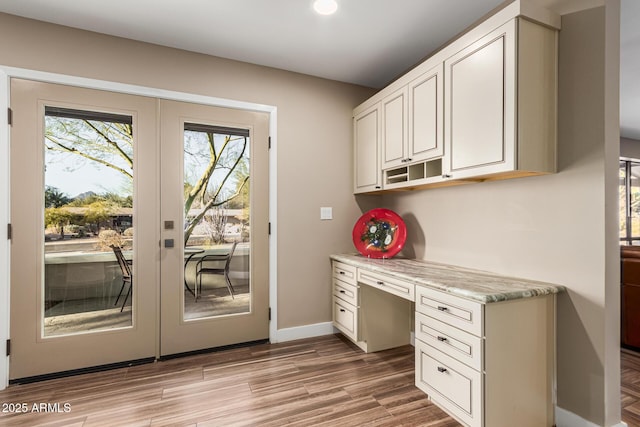 interior space featuring french doors and light wood-type flooring