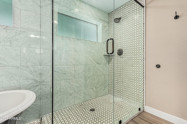 bathroom with shower with separate bathtub